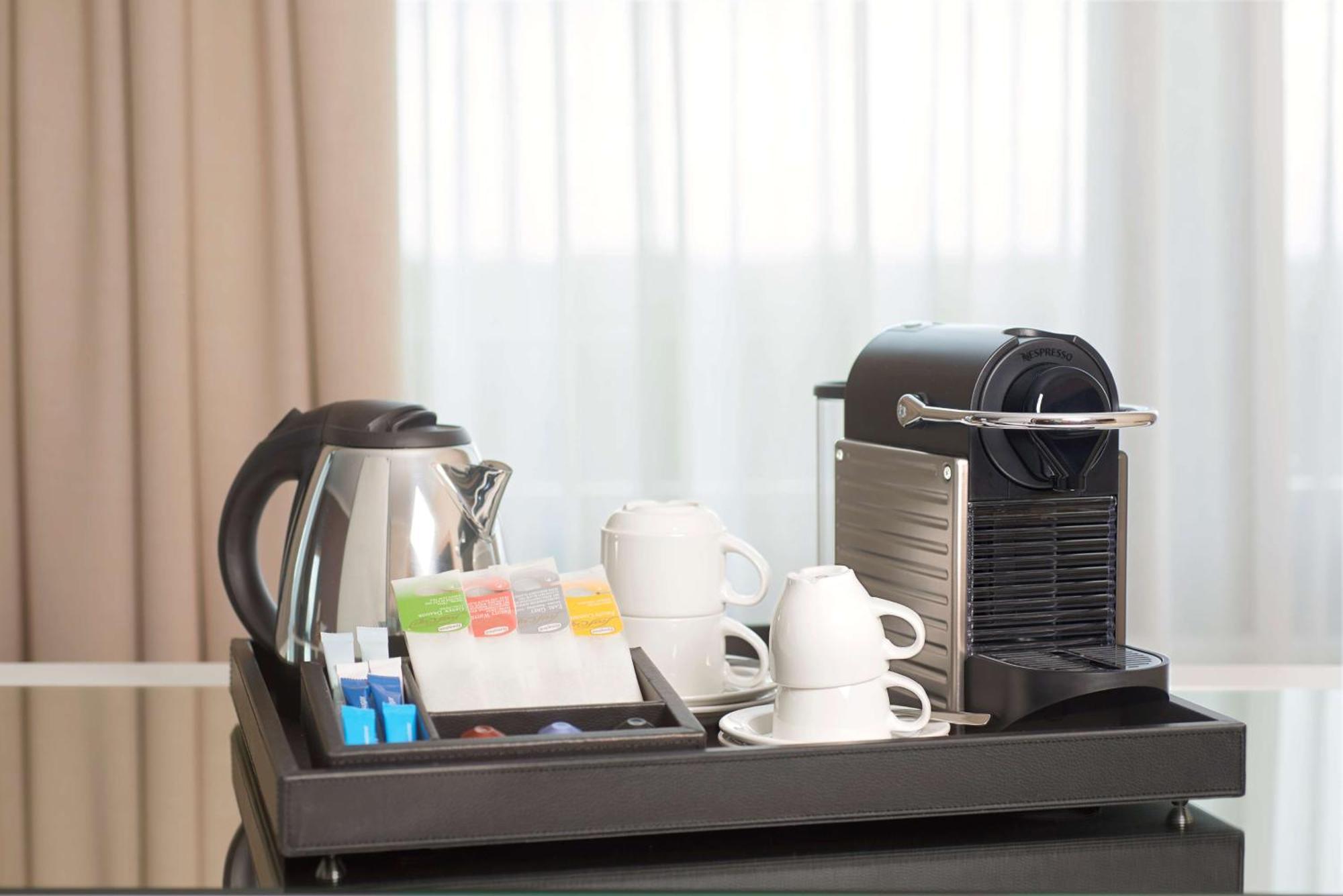 Nh Collection Plaza Santiago Hotel Exterior foto A Nespresso coffee machine in a hotel room
